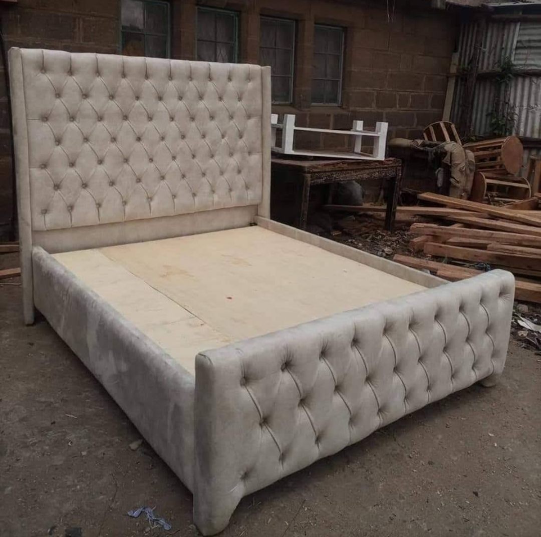 Cream tufted wingback upholstered bed