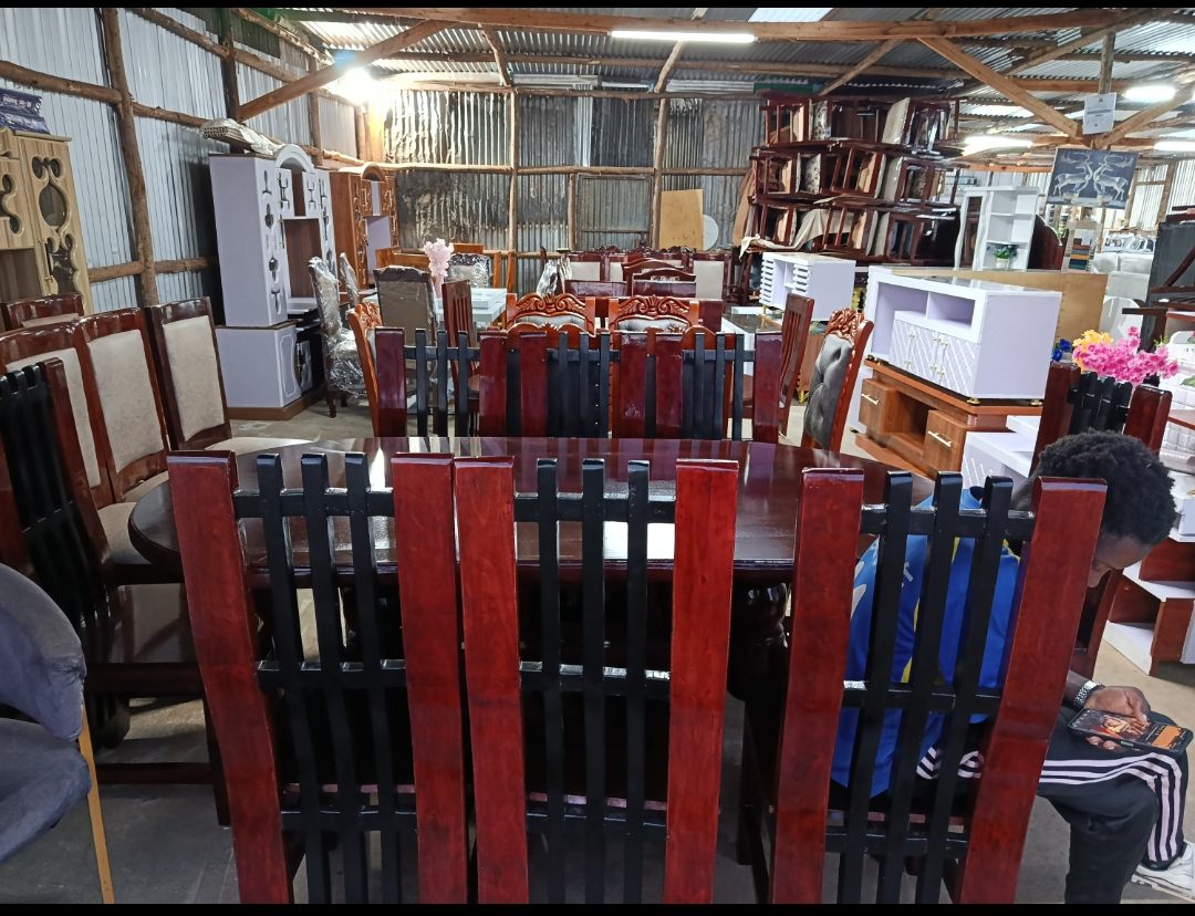 Wide view inside the Homewood showroom with dining sets and wall units