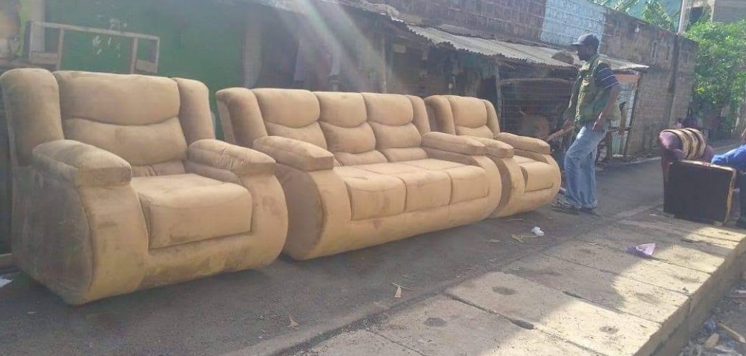 Tan suede seven-seater sofa set with cushioned arms