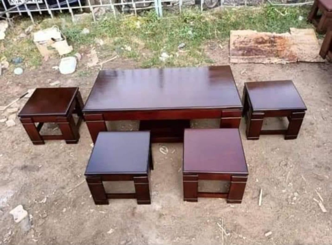 Mahogany coffee table with four nesting stools