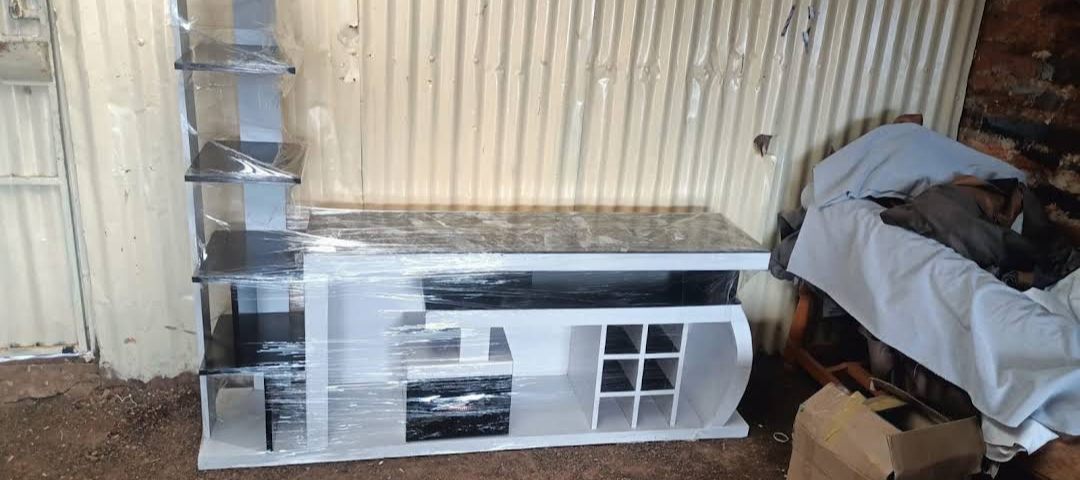 White and black marble-look TV wall unit with shelves